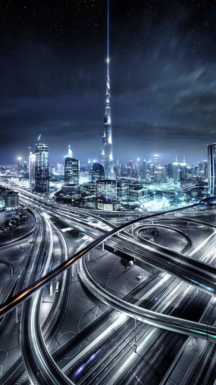 Dubai cityscape at night with Burj Khalifa and light trails