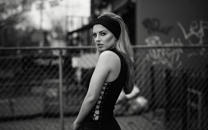 Woman with black headband and corset top