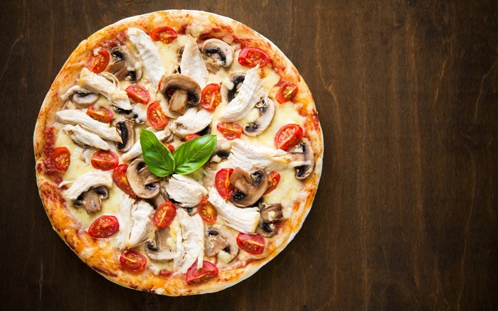 Chicken mushroom and tomato pizza with basil