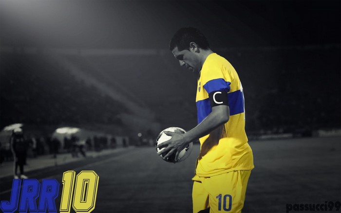 Juan Roman Riquelme of Boca Juniors holding a soccer ball