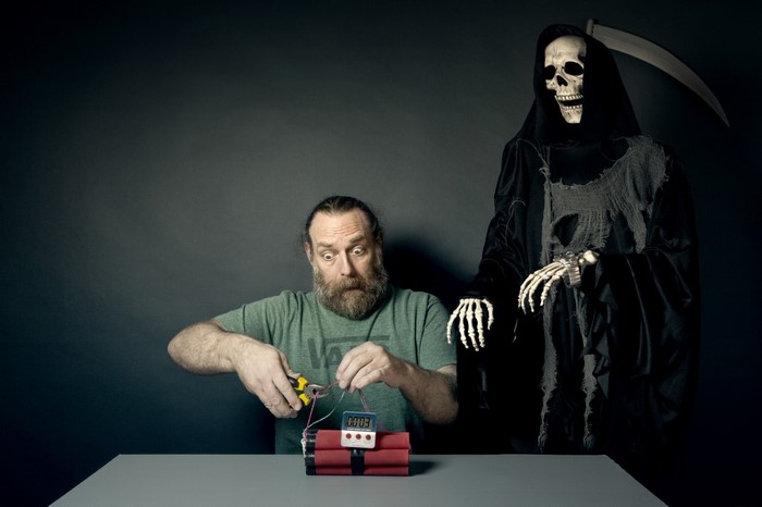 Man attempts to defuse bomb with Grim Reaper watching