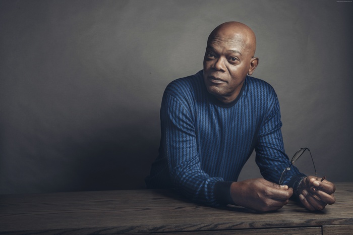 Samuel L. Jackson sitting at a table