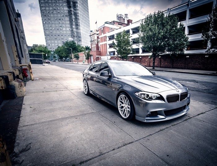 Silver BMW 5 Series Sedan on City Street
