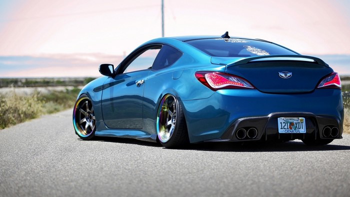 Blue Hyundai Genesis Coupe on Open Road
