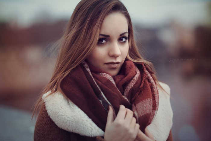 Woman with long brown hair and scarf