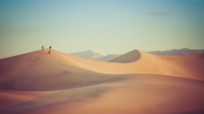 People on Sand Dunes in Desert