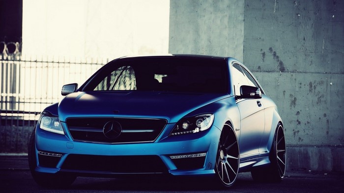 Blue Mercedes-Benz CLS 63 AMG Coupe with custom rims