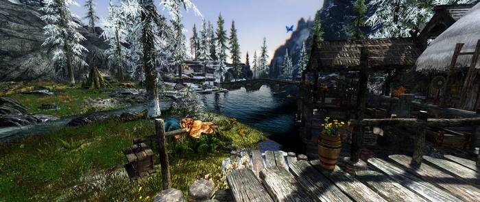 The Elder Scrolls V Skyrim screenshot of a river and village