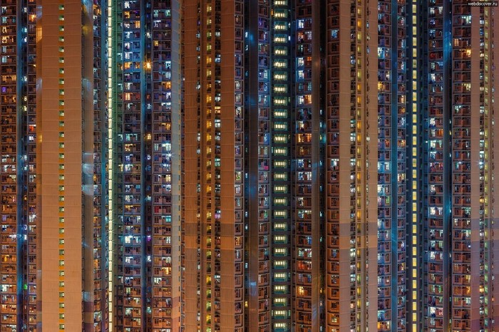 High-rise apartment buildings at night with illuminated windows