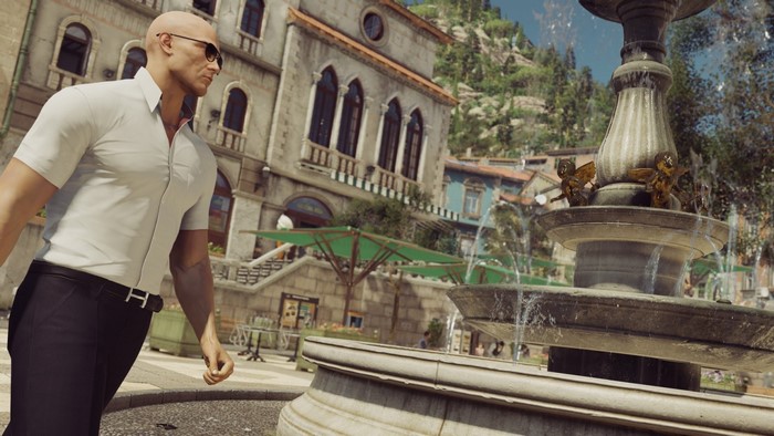 Agent 47 from Hitman in a European town square