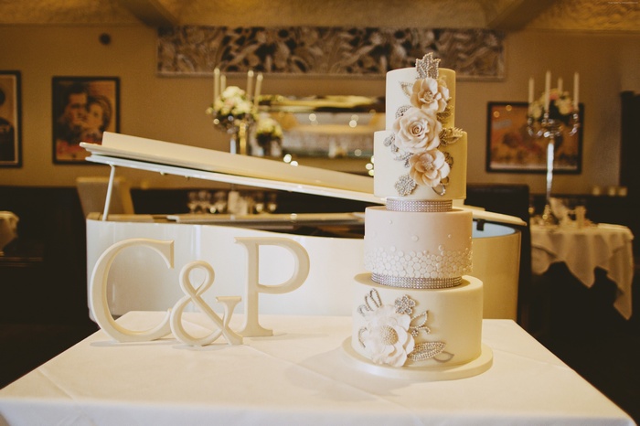 Wedding cake with flowers and letters C & P