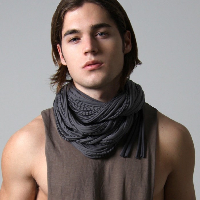 Man with long brown hair wearing a gray scarf