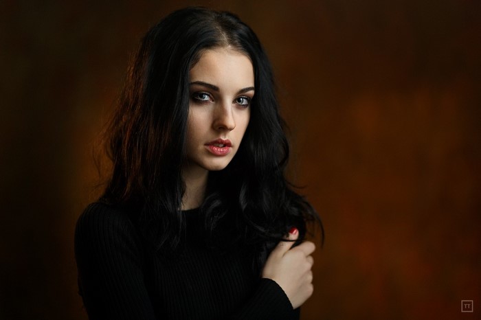 Portrait of a young woman with black hair