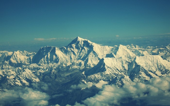 Snow-capped mountains under a clear blue sky