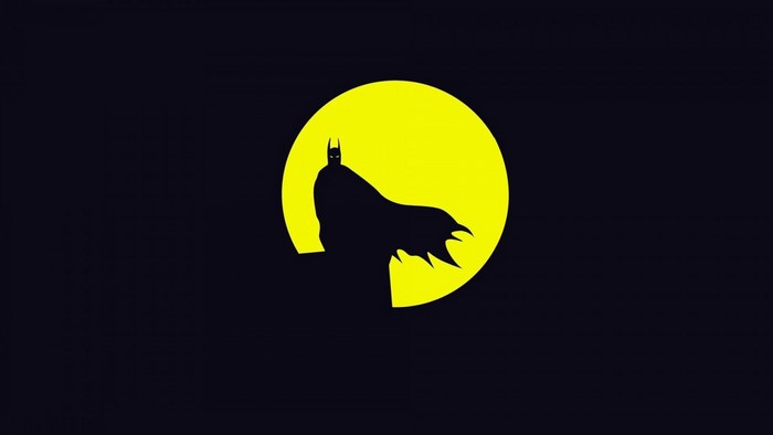 Batman silhouette against a yellow moon