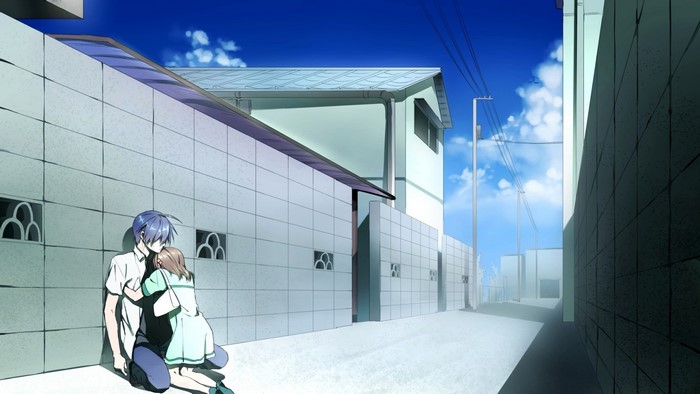 Couple hugging in an alleyway