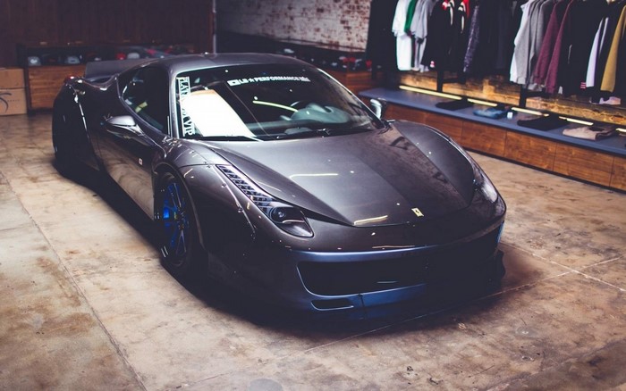 Dark gray Ferrari 458 Italia parked indoors