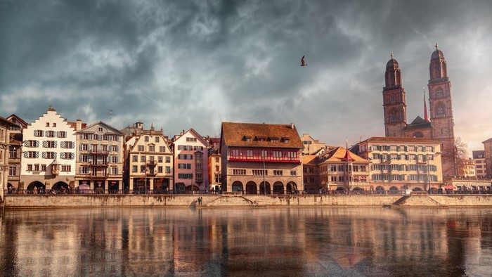 Zurich cityscape with Grossmünster church and Limmat river