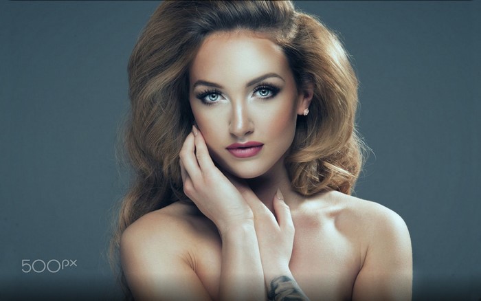 Portrait of a beautiful woman with long wavy hair