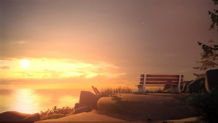 Sunset over the sea with a bench