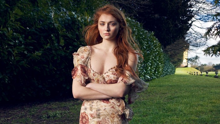 Sophie Turner in a floral dress outdoors