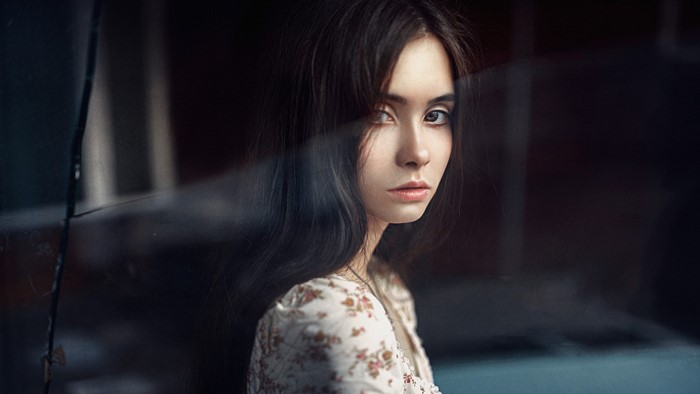 Portrait of a young woman with long dark hair