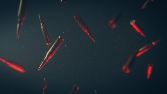 Red ammunition bullets falling in dark background