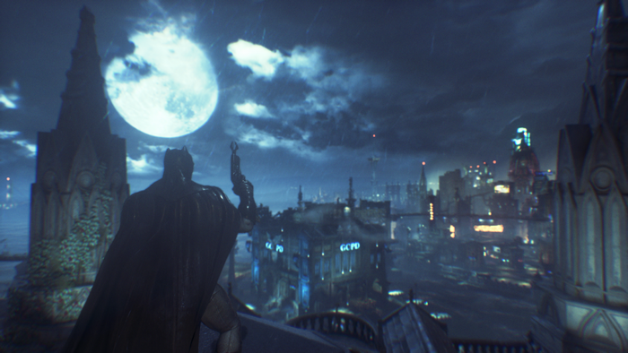 Batman from Batman Arkham Knight overlooking Gotham City at night