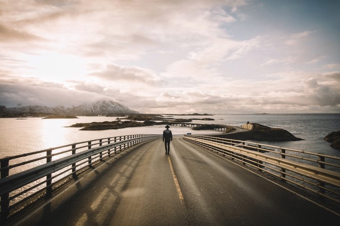 Person walking on a bridge in Norway