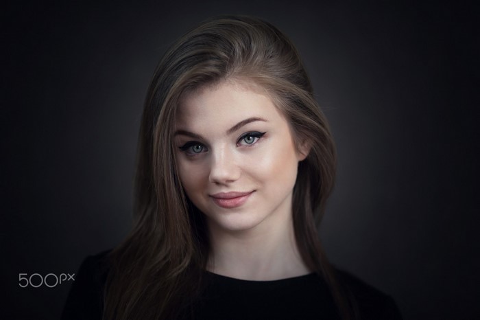Portrait of Smiling Young Woman with Long Hair