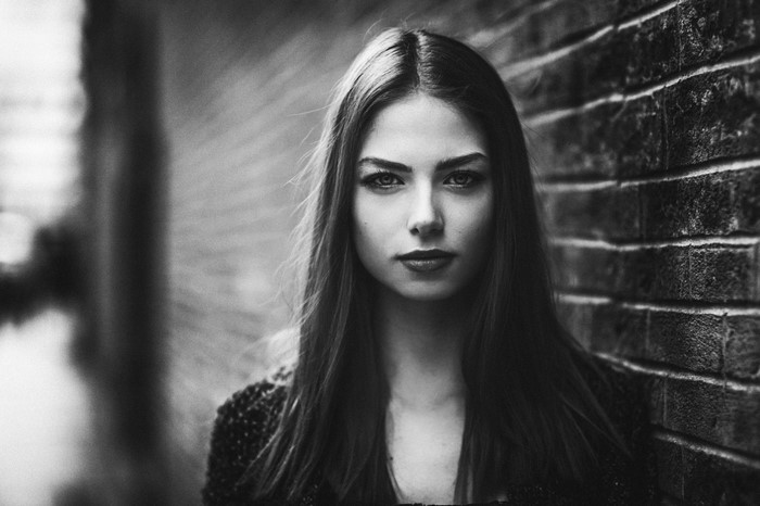 Monochrome portrait of a young woman with long hair
