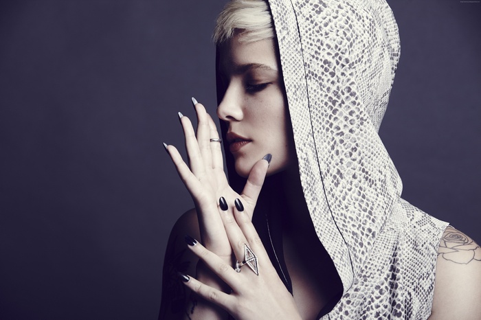 Halsey wearing a snakeskin hooded jacket