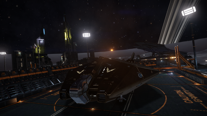 Elite Dangerous spaceship docked at a space station at night
