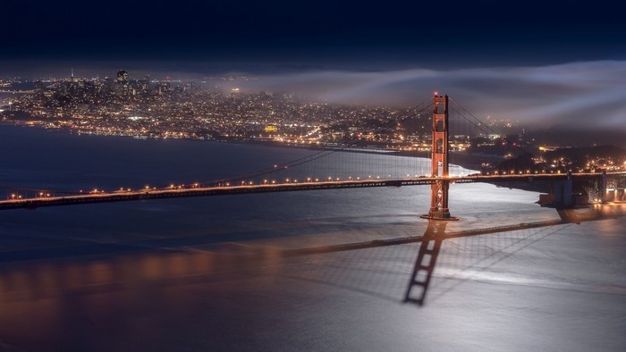 Golden Gate Bridge at night with San Francisco skyline
