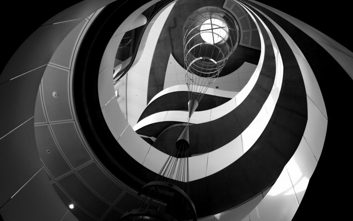 Monochrome spiral architecture with hanging lights