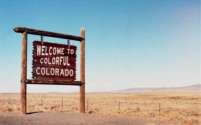 Welcome to Colorful Colorado Sign in Desert Landscape