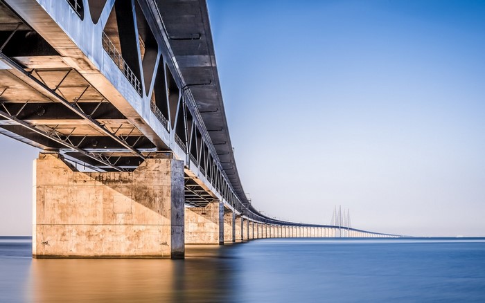 Oresund Bridge over blue sea under clear sky