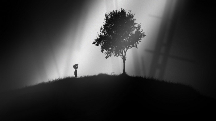 Silhouette of a boy and a tree in Limbo