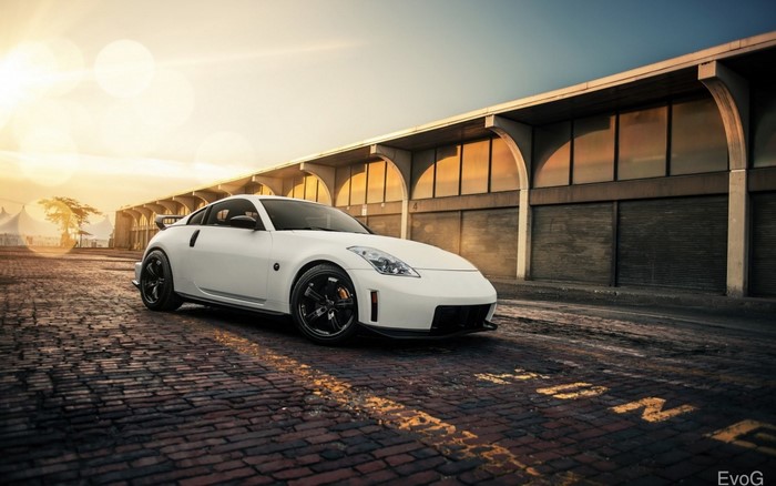 White Nissan 350Z sports car parked on brick road