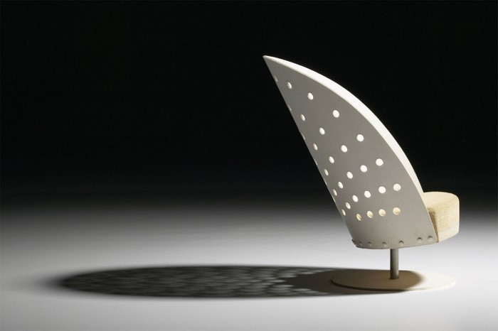 Modern perforated chair with a unique wing-like design