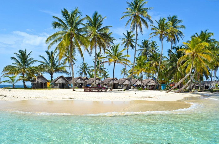 Tropical island with palm trees and huts