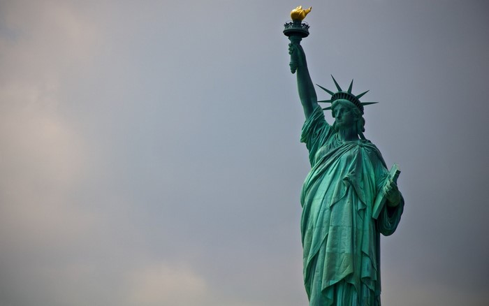 Statue of Liberty against a cloudy sky