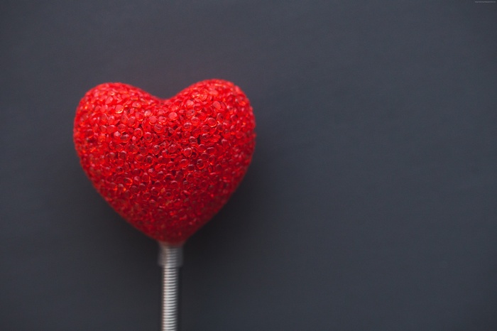 Red beaded heart on a spring