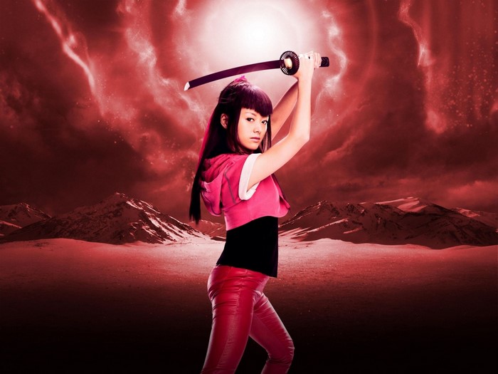 Girl with sword in red landscape