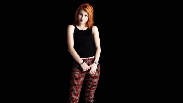 Hayley Williams from Paramore posing in plaid pants