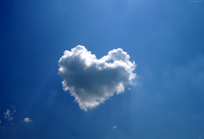 Heart-shaped cloud in a blue sky