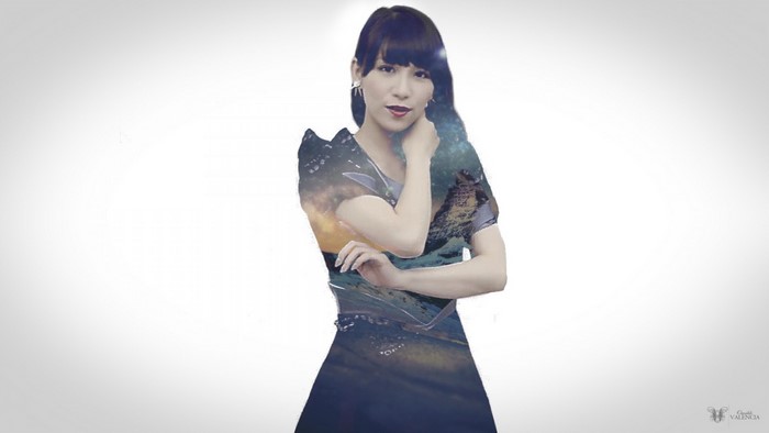 Woman with double exposure of nature and galaxy