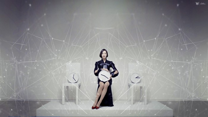 Perfume Band members with clocks in a futuristic setting