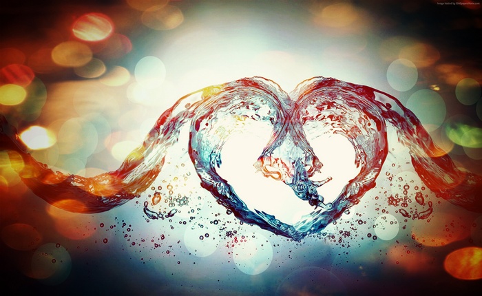 Water splashes forming a heart shape