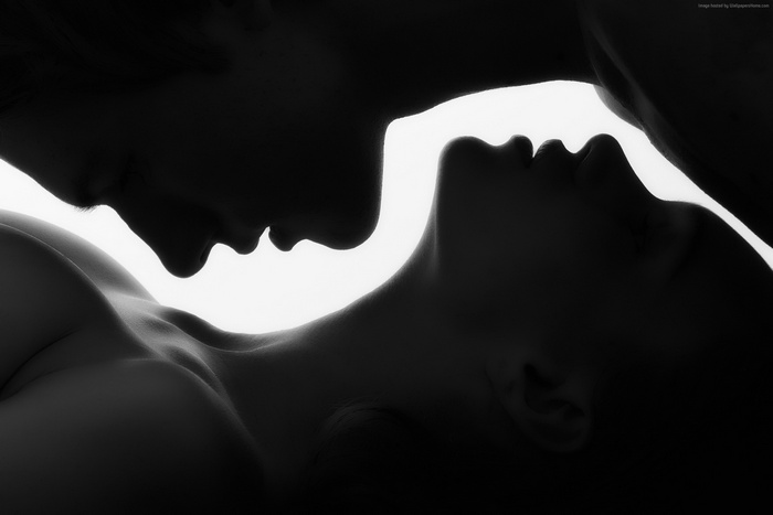 Couple in silhouette embracing